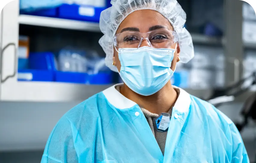 Closeup of Mariana Oncology scientist wearing eye protection working in the lab